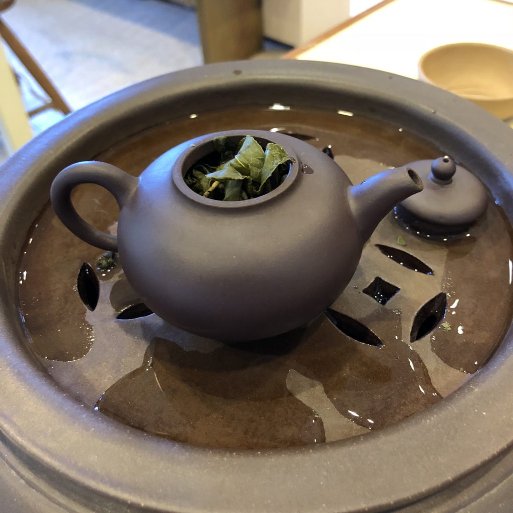 Taiwanese Teapot and tea tray with tea inside
