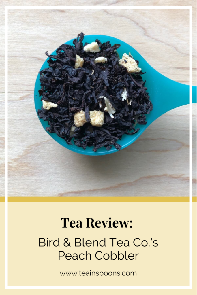 Pin of spoonful of black tea leaves