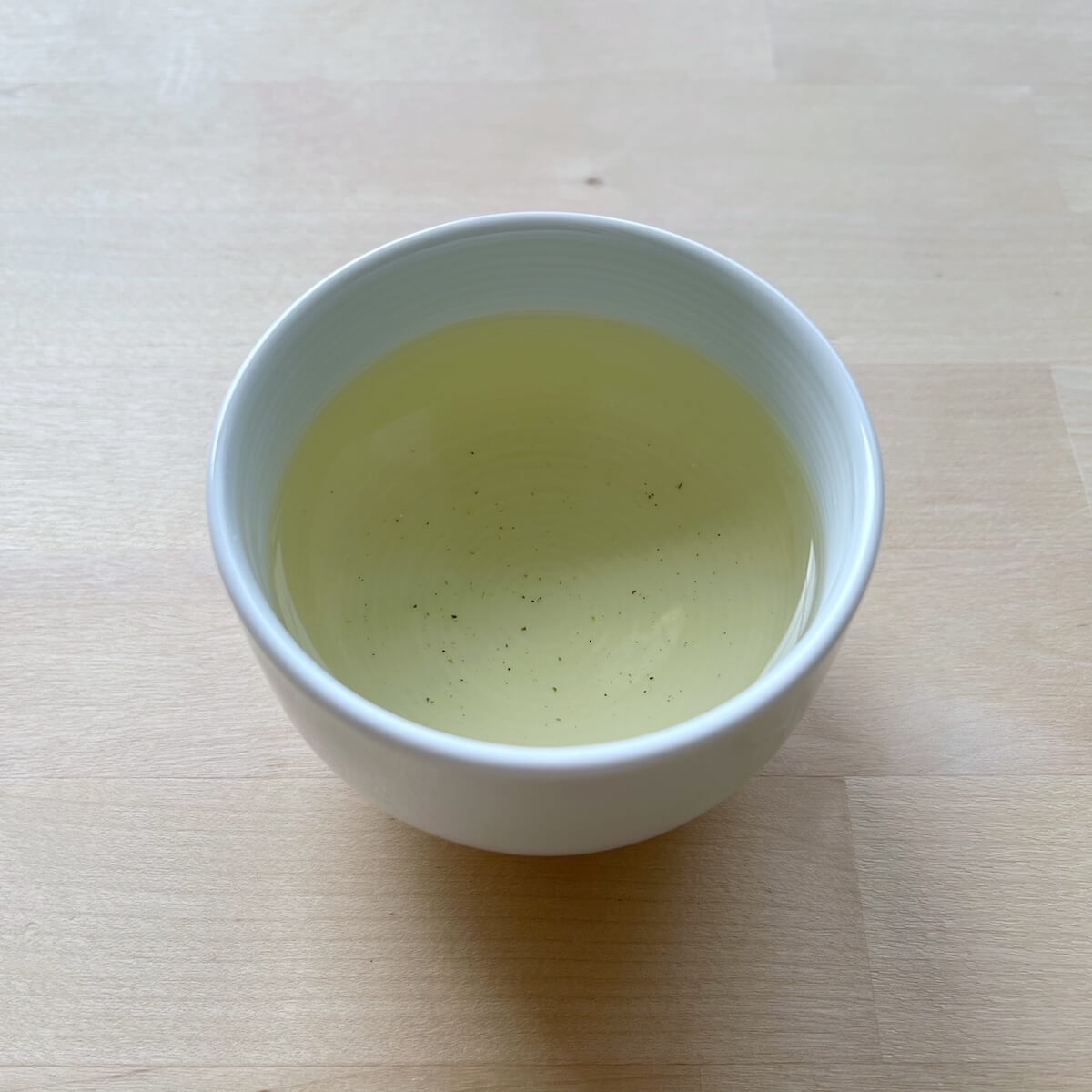 Cup with yellow tea