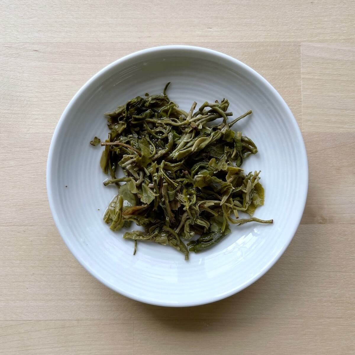 Dish of infused green tea leaves
