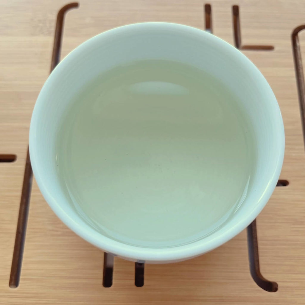 Cup with clear pale yellow liquor