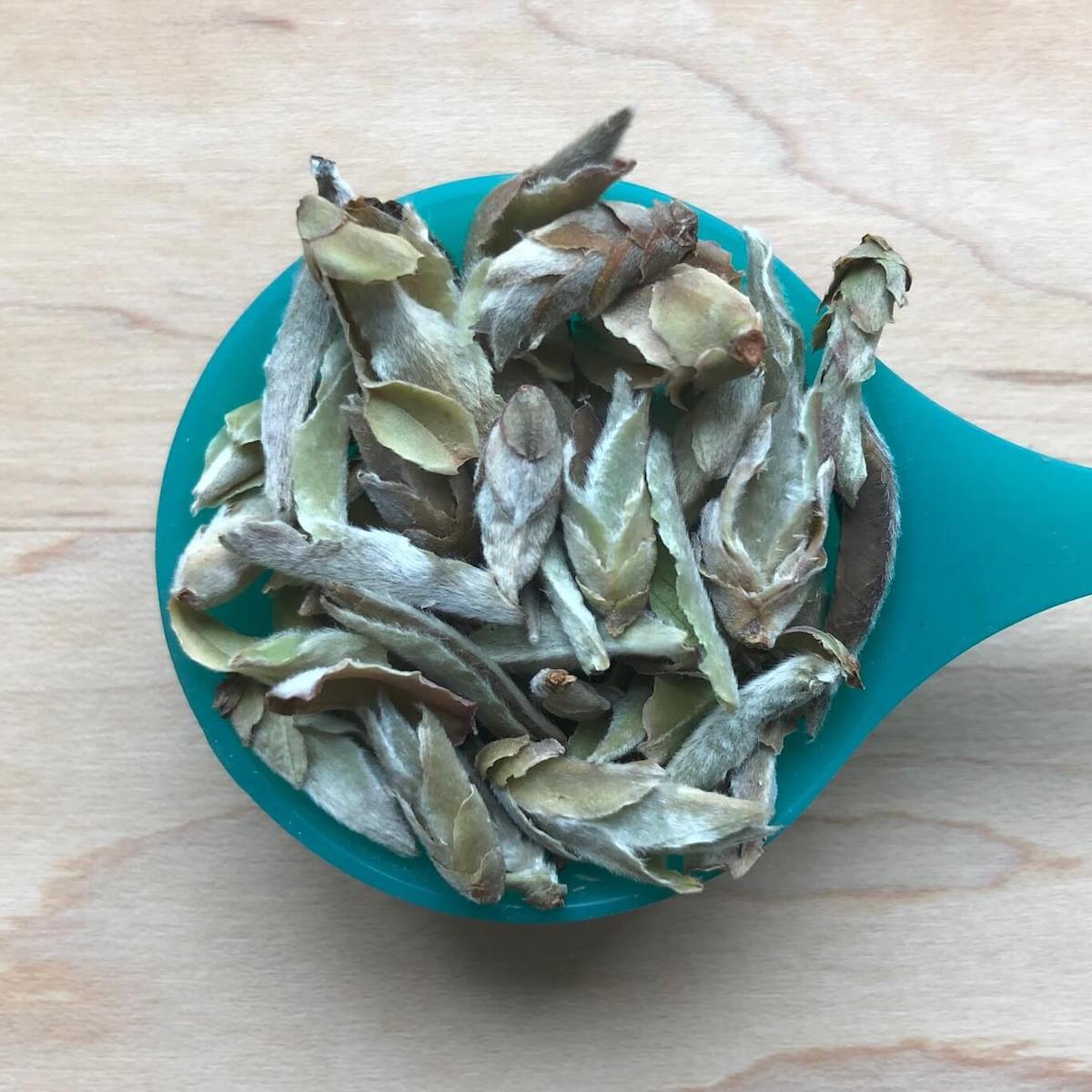 Spoonful of fuzzy white tea